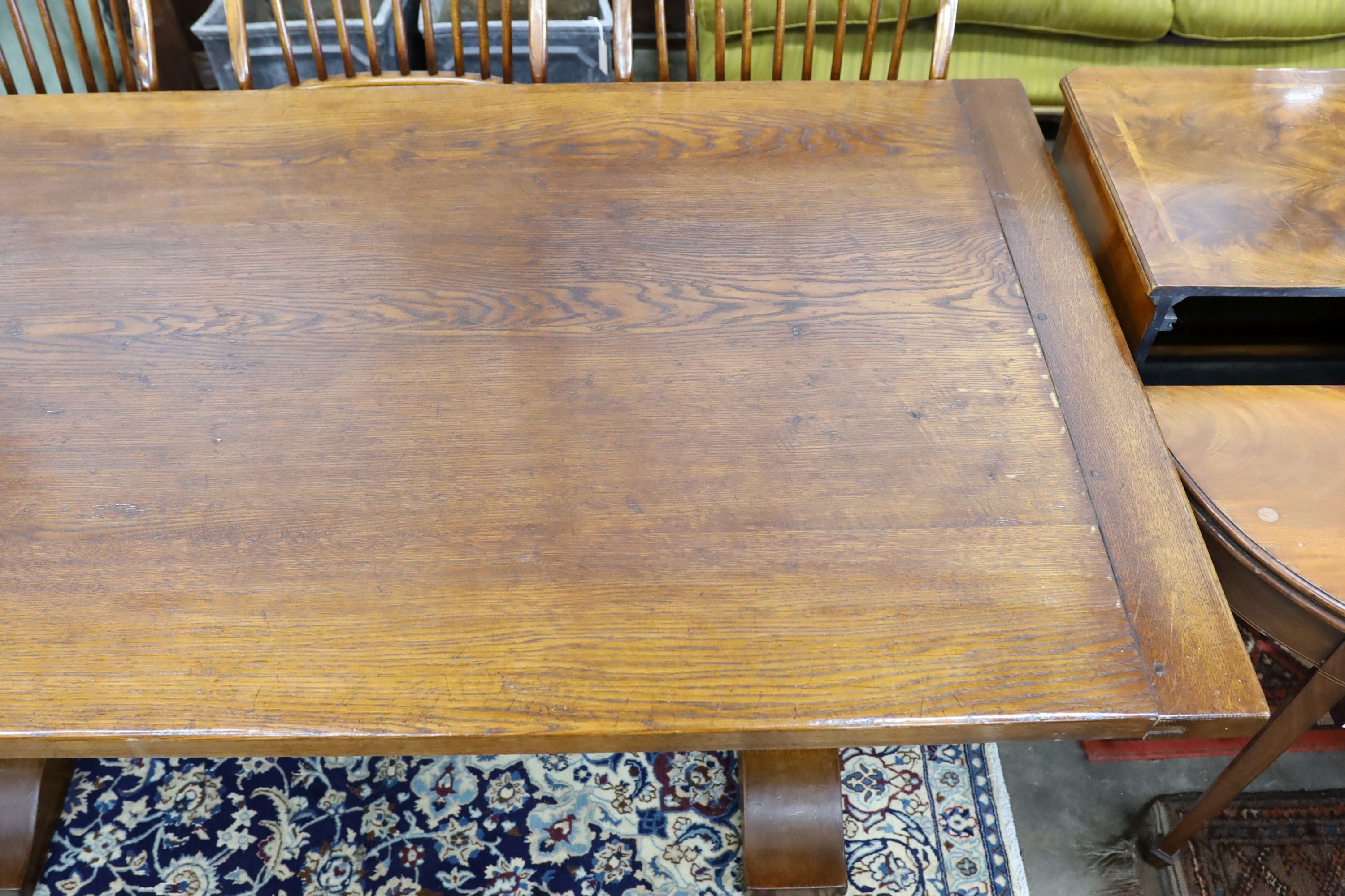 A 17th century style rectangular oak refectory dining table, length 183cm, depth 100cm, height 76cm